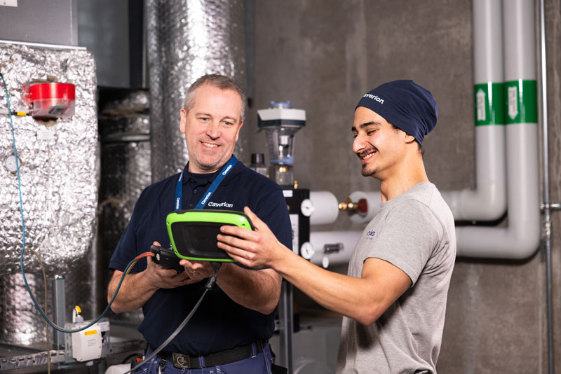 employees-smiling-looking-at-monitor.jpg