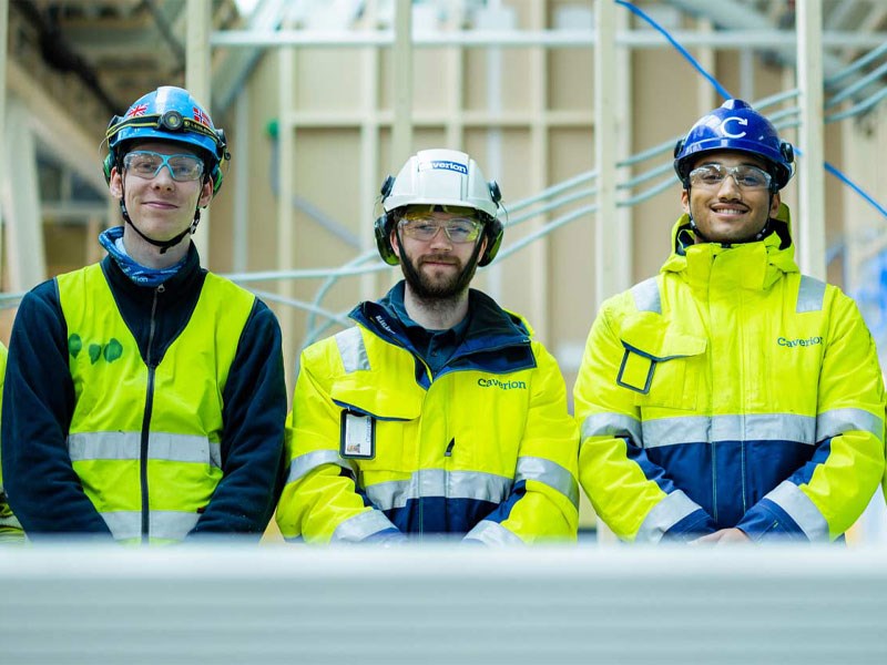 Smiling employee with helmet