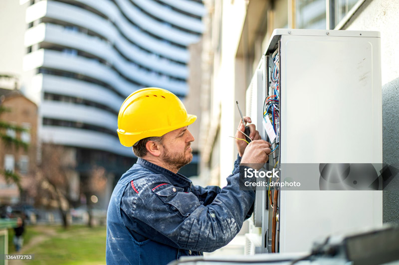 electrician-wearing-yellow-helmet.jpg
