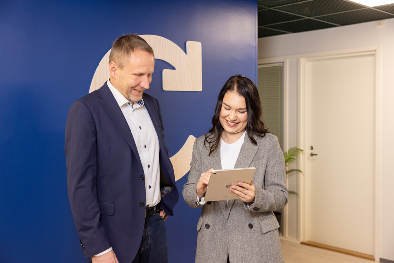 two-employees-looking-at-a-tablet.jpg